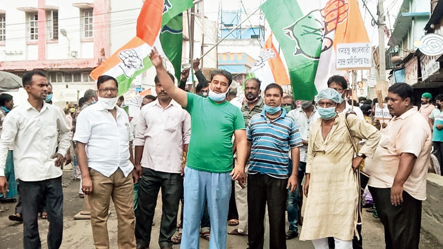 Congress workers block a road in Basirhat on Friday in protest against the Hathras incident