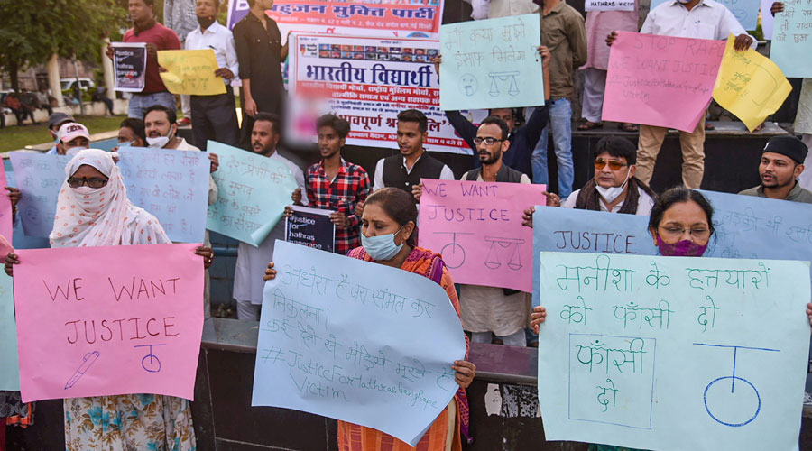 Members of various organisations stage a protest against the alleged gang-rape of a 19-year-old Dalit woman in Uttar Pradesh’s Hathras in Bhopal on Friday.