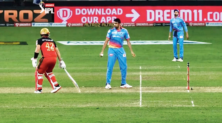A TV grab shows Ravichandran Ashwin stopping in his delivery stride as RCB’s Aaron Finch is away from the crease. 