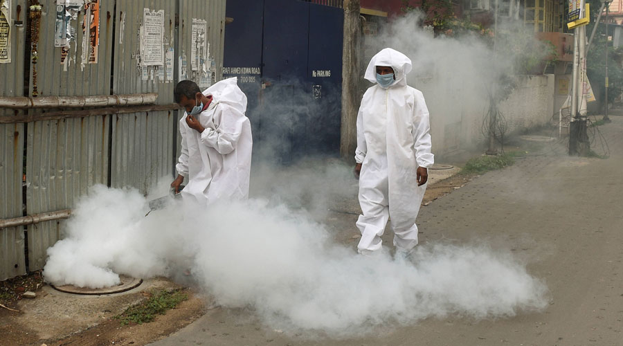 Municipal corporation workers fumigate in a locality amid concerns over Covid-19 outbreak, during ongoing nationwide lockdown, in Calcutta