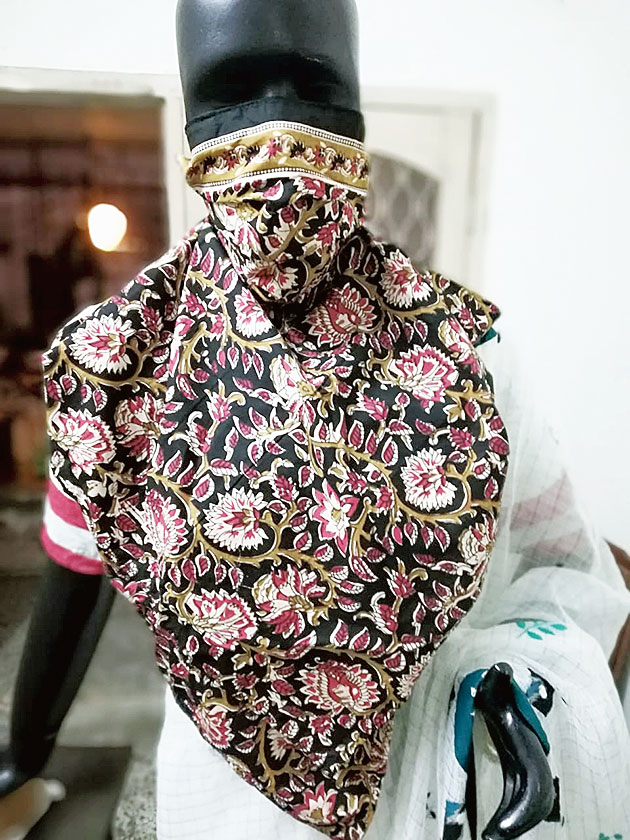 A new design of mask-cum-dupatta launched by Pratyasha boutique in AE Block for the Pujas
