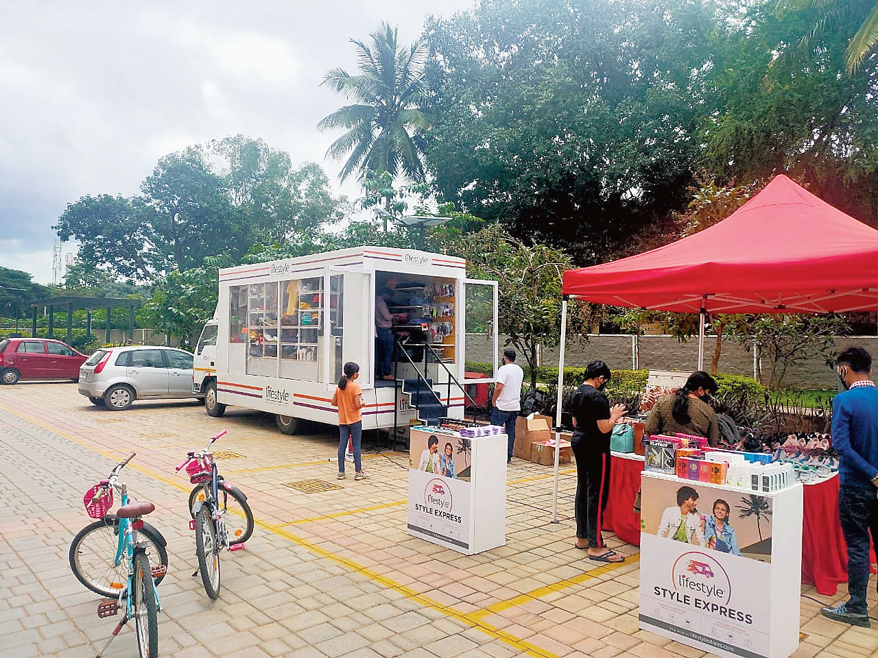 A canter van displaying clothes of Axis Mall’s Lifestyle brand in the parking lot of Balaka Abasan