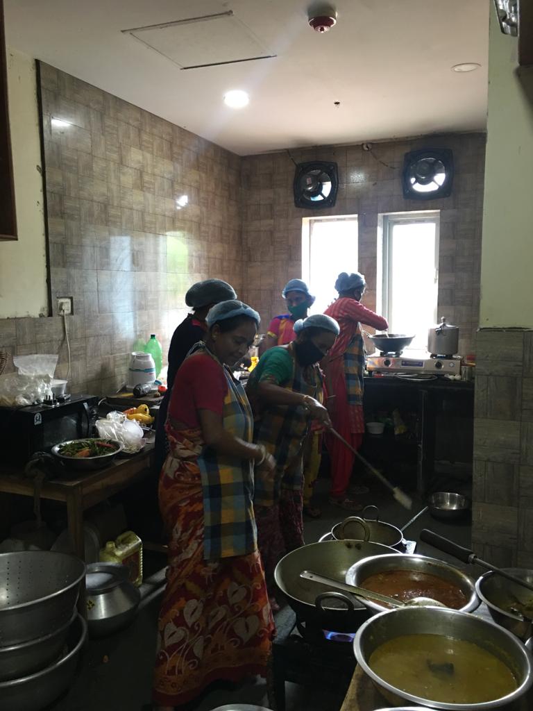 Women SHG members prepare meals at the CADC canteen for doorstep delivery