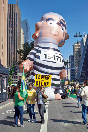 The protesters brought giant balloon cartoons of political leaders