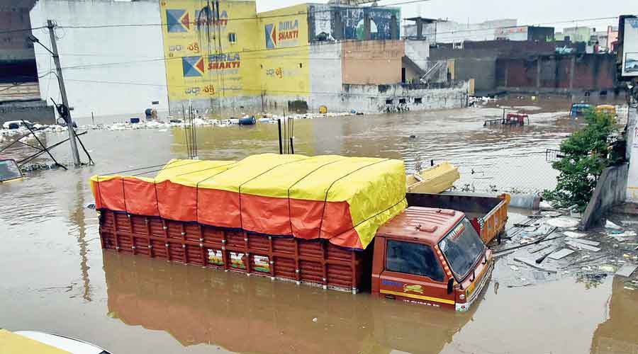 Vehicles submerged in floodwaters