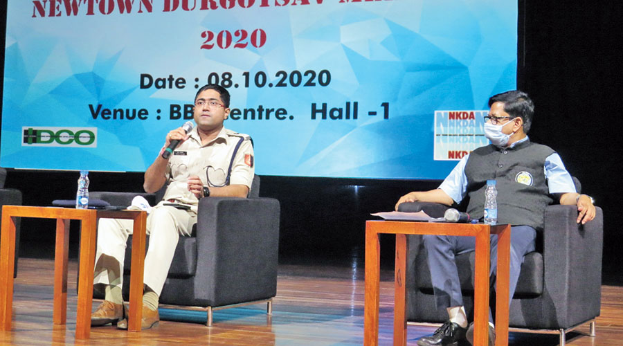 Deputy commissioner, New Town, Bishop Sarkar addresses the audience at Biswa Bangla Convention Centre as Hidco chairman Debashis Sen looks on.
