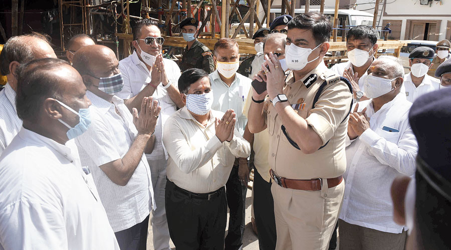 Gearing up: Calcutta police commissioner Anuj Sharma at the Mohammad Ali Park Durga Puja pandal on Thursday. Only those wearing masks should be allowed inside pandals, Sharma instructed his force after inspecting some pandals in south and central Calcutta on Thursday. Sharma asked his officers to ensure that the puja committees make adequate arrangements for hand sanitisers, everyone wears a mask and social distancing is enforced in shopping areas before Durga Puja. The top cop asked the officers in charge of police stations to ensure regular announcements are made in market areas to create awareness about wearing masks and sanitising hands. Sharma also visited Deshapriya Park, Chetla Agrani, Suruchi Sangha, Naktala Udayan Sangha and the College Square Sarbojanin puja pandals.