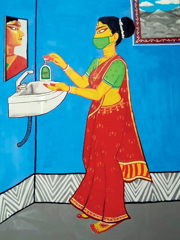 An artwork at Jagat Mukherjee Park, made with acrylic on a canvas of wood and clothes depicts Durga sanitising her hands