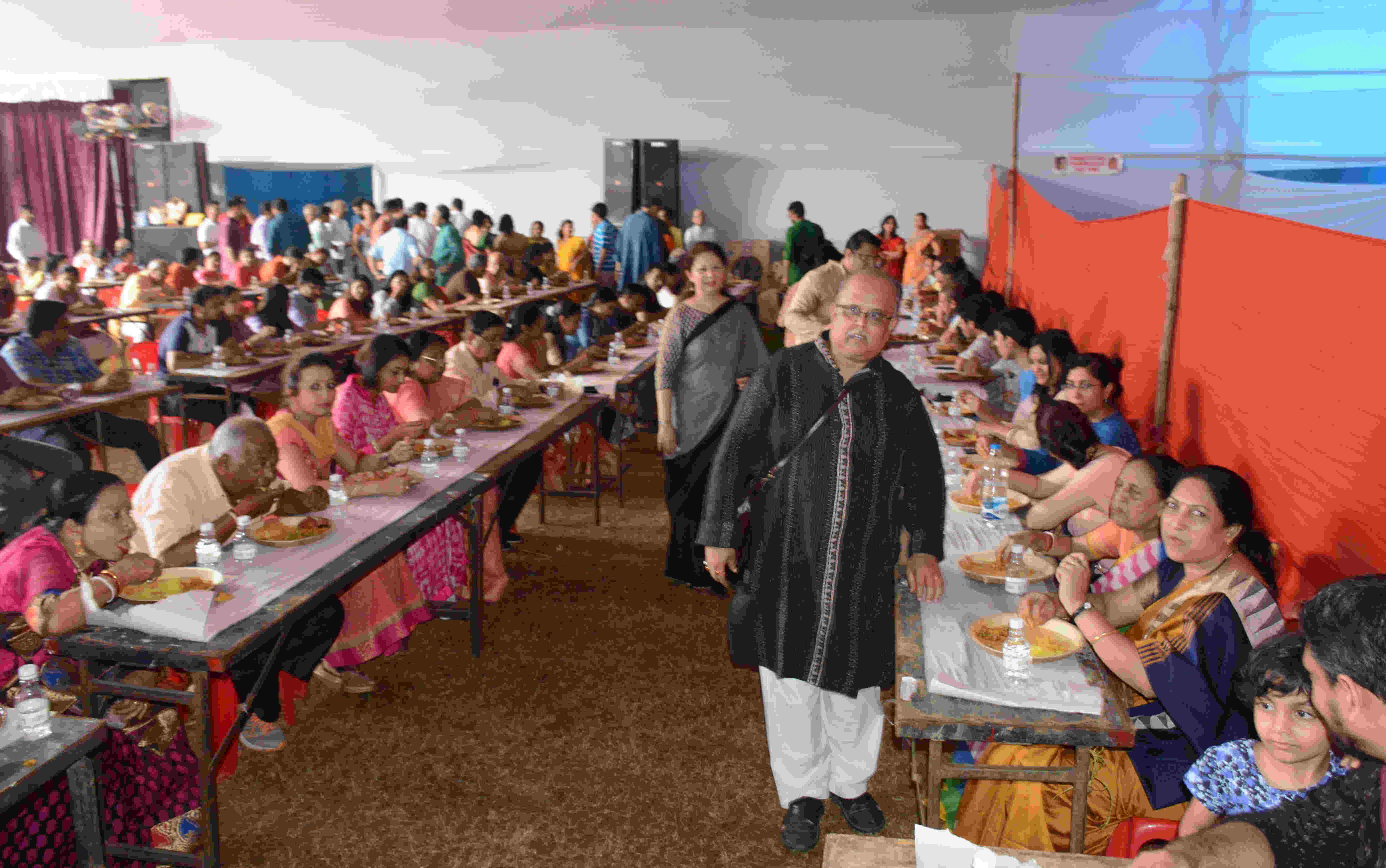 The Northern Town and Circuit House Area Durga Puja Committee members enjoy bhog at the Circuit House Area ground in Jamshedpur last year.