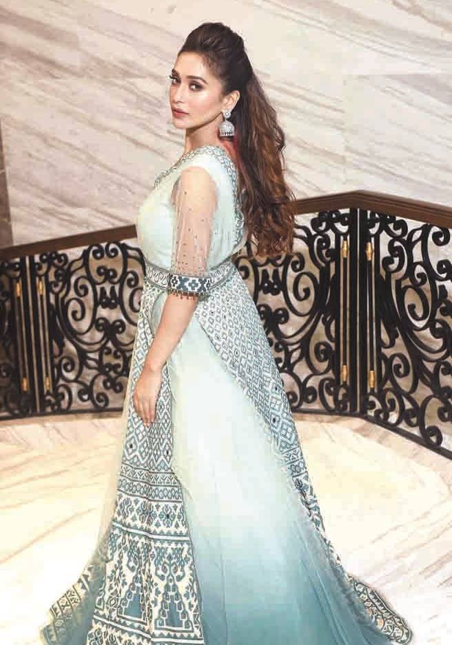 1. Mimi cut a picture of serene sophistication in this Tarun Tahiliani raw silk Anarkali with shaded applique embroidery, high. lighted with mirror-work. The hair was pulled back and the mouth got a touch of pink. The diamante jhumkas were the perfect accessories.