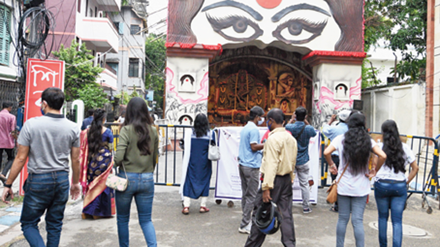 Visitors at the Shibmandir puja pandal on Saptami afternoon.