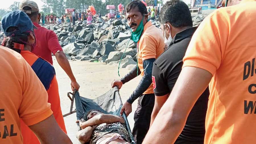 Nulias rescue a bather in Digha on Tuesday.