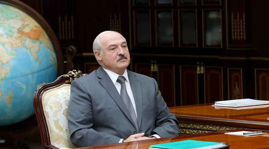 Belarusian President Alexander Lukashenko listens to Valiantsin Sukala, head of the Supreme Court of Belarus during their meeting in Minsk, Belarus, on Monday