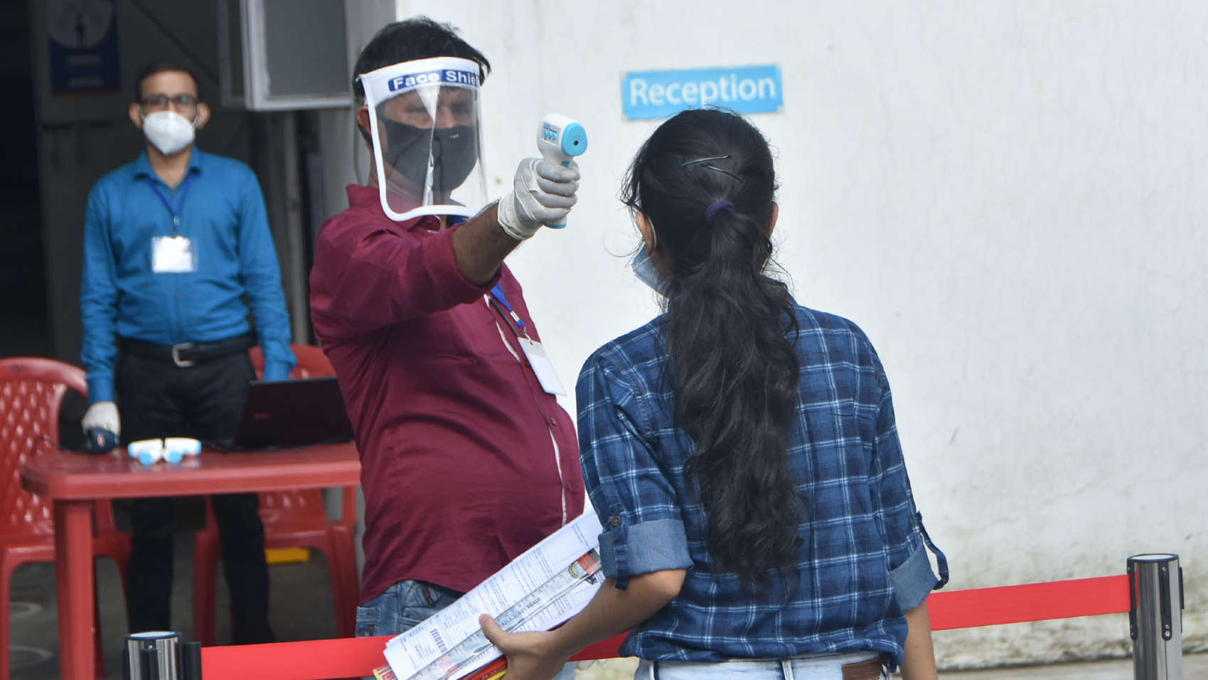 A thermal scanner being used to check a student at an examination centre in Dhanbad on Tuesday.