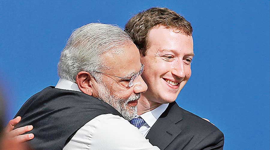 Prime Minister Narendra Modi locks Facebook CEO Mark Zuckerberg in a tight hug at the company’s headquarters in Menlo Park, California, in September 2015.