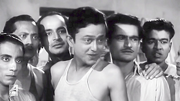 5. The film that introduced Bhanu Bandyopadhyay as an unique talent was Basu Paribar. But this is a still from the movie which launched him as a lead actor. In this scene he is seen with a bunch of very talented co-stars. Identify the one to his exact left and one to his extreme right.