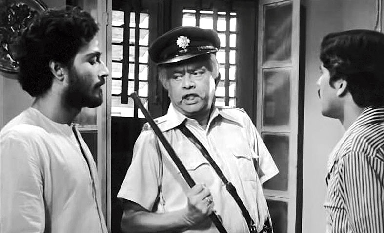 8. In this movie, Bhanu Bandyopadhyay represented the system and all that is wrong with the system. Cine lovers still remember him saying in his caustic tone – ‘In the Indian penal code, the father is not hanged for a murder committed by the son!’ This movie launched another very talented actor who is present in this scene. Who was this actor?