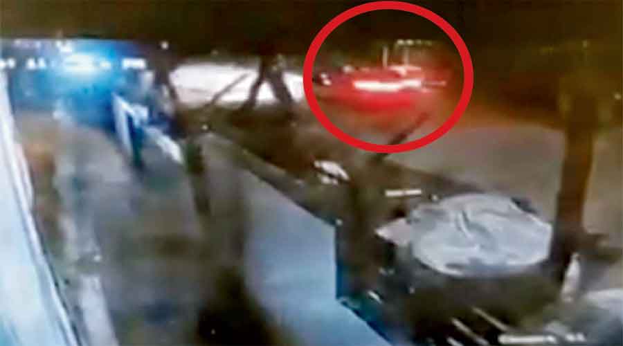 CCTV footage shows the purported car speeding away  after the bank employee was allegedly thrown out