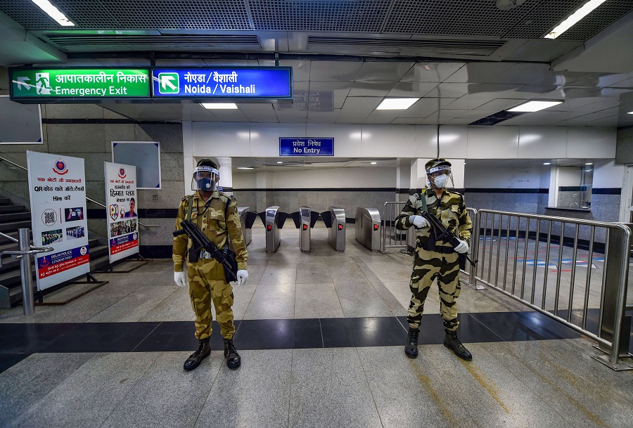 Security personnel stand guard at Rajiv Chowk station in New Delhi on Monday.