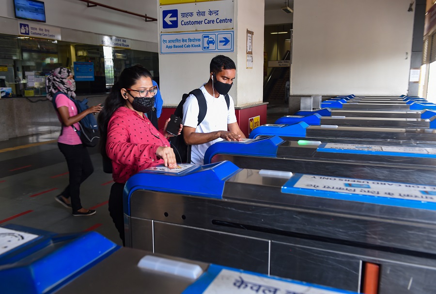 Commuters enter HUDA City Centre station in New Delhi on Monday.