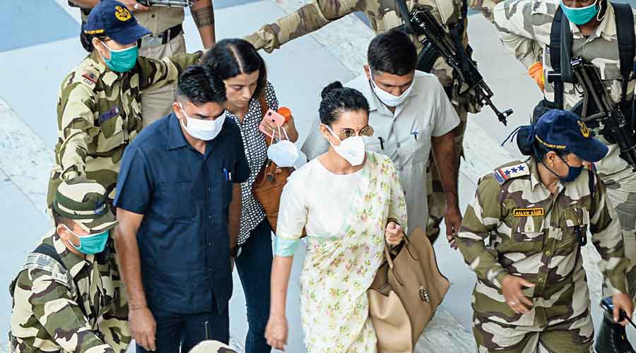 Actress Kangana Ranaut walks in a ring of security at the airport in Chandigarh on her way to catch a flight to Mumbai on Wednesday. By the time she landed, Brihanmumbai Municipal Corporation had demolished “illegal alterations” at her Bandra office.