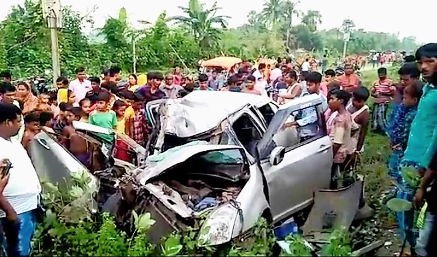 The mangled remains of the car that met with the mishap on NH12 in Rejinagar, Murshidabad.