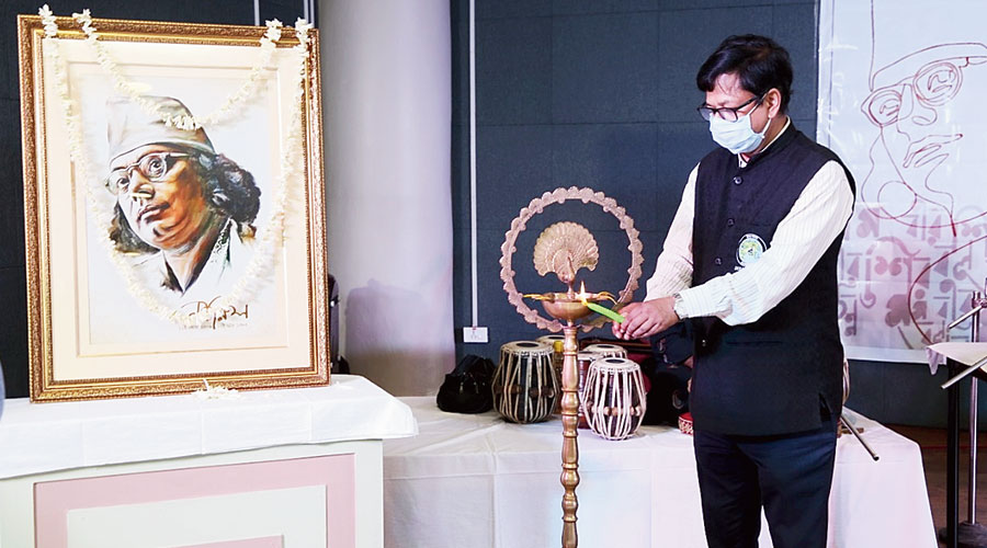 Hidco chairman Debashis Sen lights a lamp to open the show at Nazrul Tirtha in tribute to Kazi Nazrul Islam that was webcast on August 29
