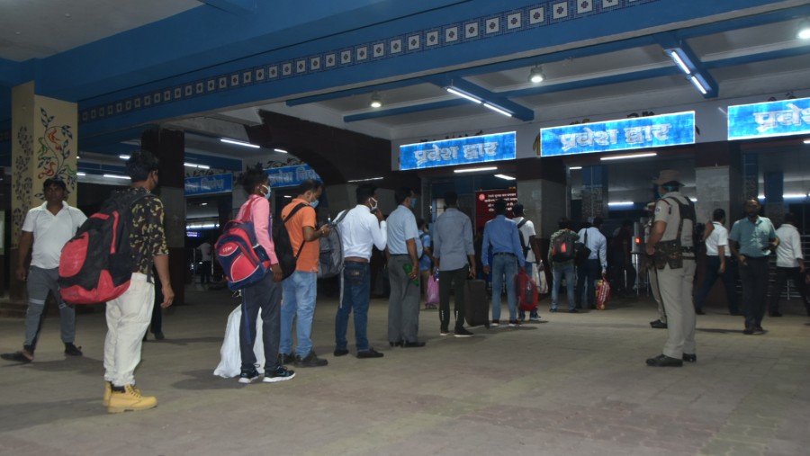 Passengers queue up to enter the Dhanbad railway station on Saturday.