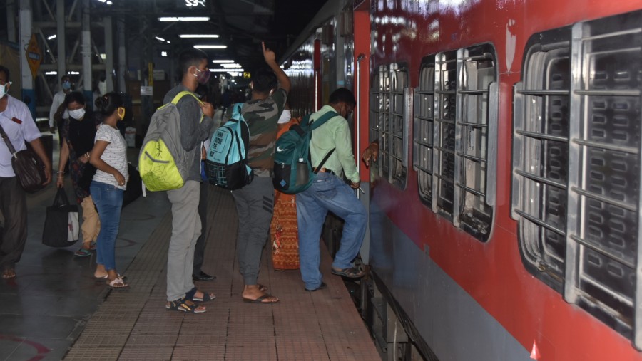 Passengers board the train at Dhanbad railway station on Saturday.