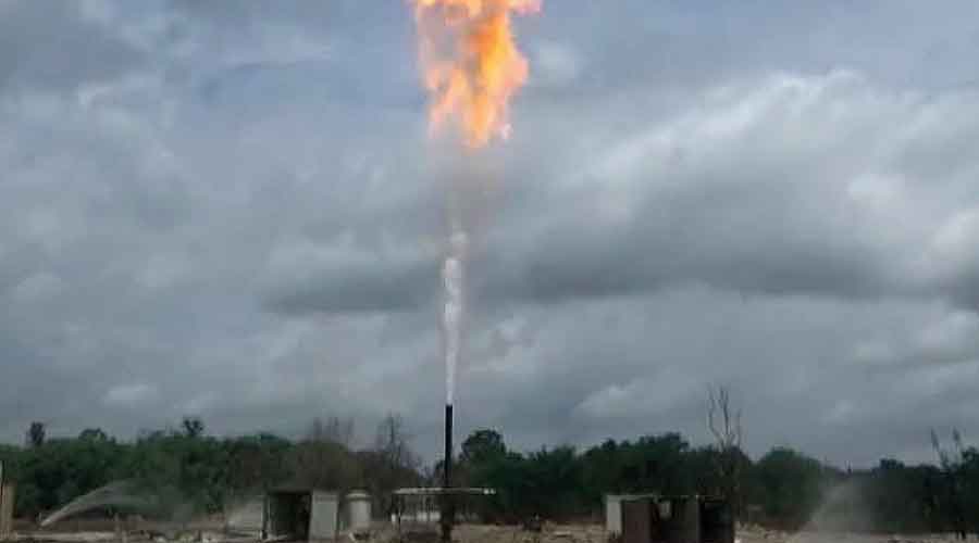 Flames rise from the gas well head at Baghjan.