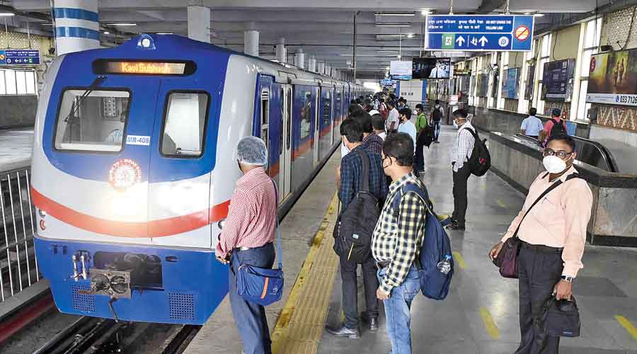 A train rolls into the platform at  Dum Dum Metro station