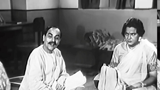 4. This is another hallmark in the illustrious career of Bhanu Bandyopadhyay. Needless to say, he is playing a woman in this scene. Name the movie and the co-actor, who himself was a tremendous talent and impressed Rabindranath Tagore and Mahatma Gandhi through his songs. He was also a favourite of Satyajit Ray.