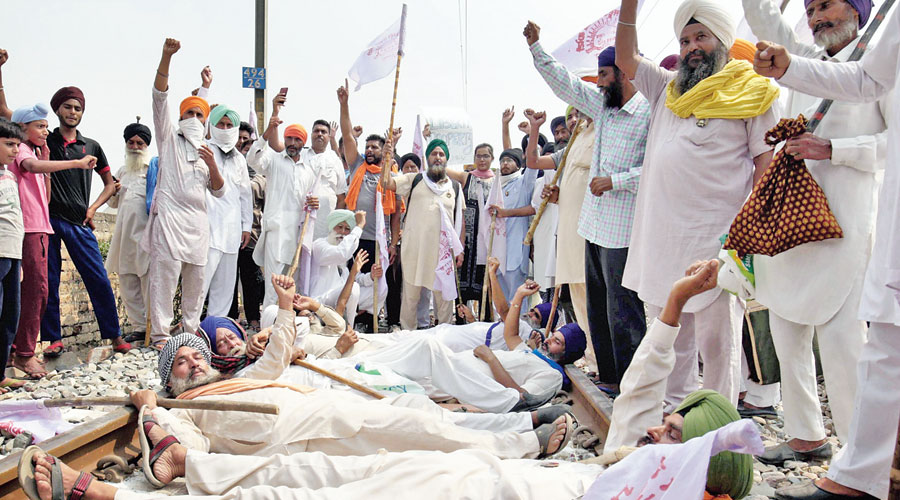 Farmers on Thursday block railway tracks in Punjab during a protest against  the farm bills. 