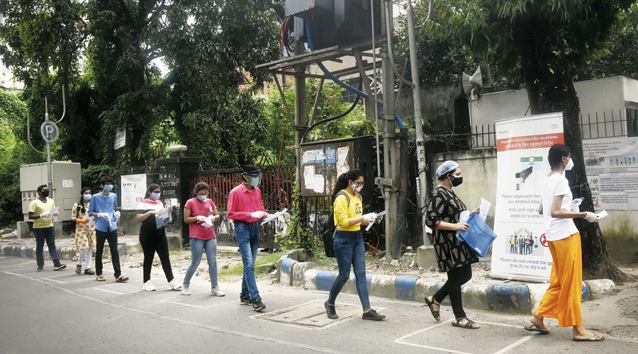Students enter TCS Gitobitan in Salt Lake’s Sector V for the Common Law Admission Test on Monday. 