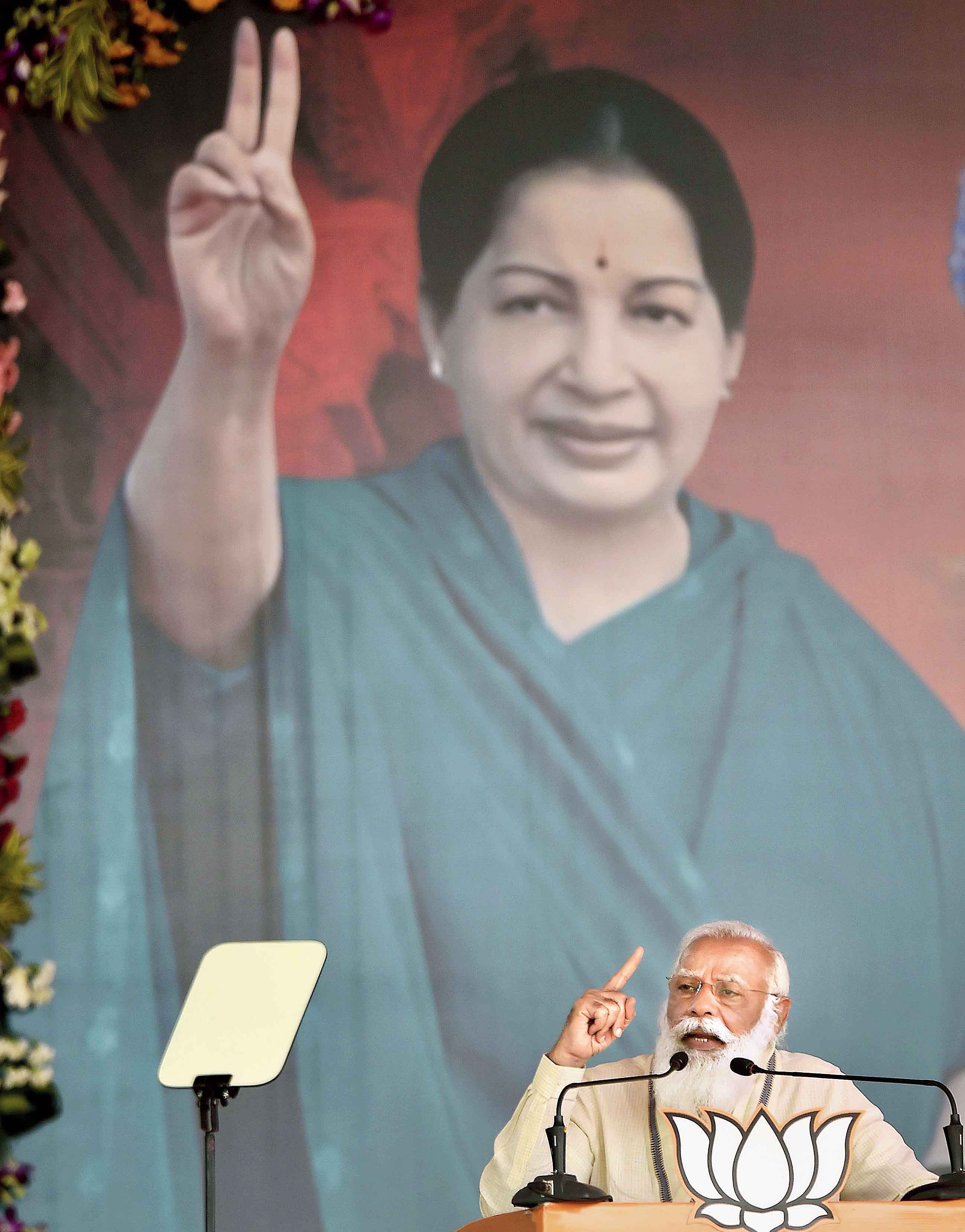 With a portrait of the late Jayalalithaa providing the backdrop, Prime Minister Narendra Modi campaigns for the BJP and its allies, which include the AIADMK, in Madurai in Tamil Nadu on Friday 