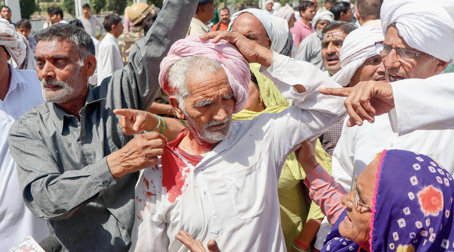    Elderly farmer bleeds in Haryana protest-  police tried to stop the agitators from marching into Rohtak city