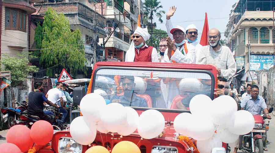 Bengal Congress president  Adhir Ranjan Chowdhury (left) at a road show in support of the party’s candidate Sukhbilas Burma in Jalpaiguri