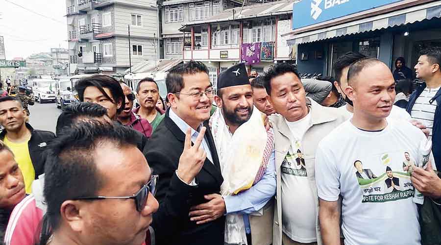 GNLF leader Ajoy Edwards (left) with Keshav Raj Pokhrel, the candidate of the Binay Tamang camp, in Darjeeling on Wednesday