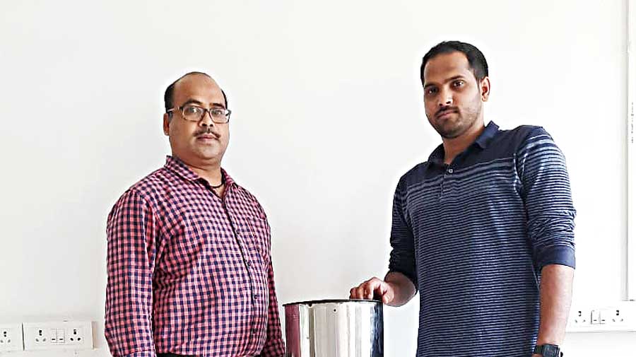 Sanjay Kumar Swain (left) and Amulya Ranjan Panda with the arsenic filter developed by them