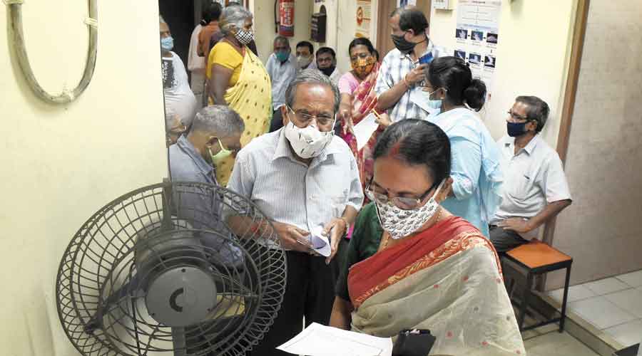 People wait to get vaccinated at the ward clinic at Raja Subodh Mullick Square on Tuesday morning.  People who went to the clinic in the afternoon were asked to come the next day