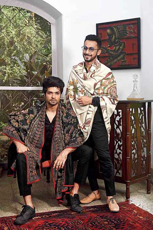 Make-up pro Abhijit Chanda is in front of the camera this time and he carries off this three-layered nakshi kantha shawl with grace. “This has guri run. The origin of kantha was two-three layers of it stitched together. They would draw from whatever was around them. Kantha was a quilt. Now kantha has become the stitch. These are the original kantha looks and all of them have the guri run, which is most special for me. It is a colour-on-colour guri run. It takes up to a year to complete a shawl of this kind,” says Malika. Iqbal too sports a nakshi kantha shawl made dramatic with black shirt and black trouser.