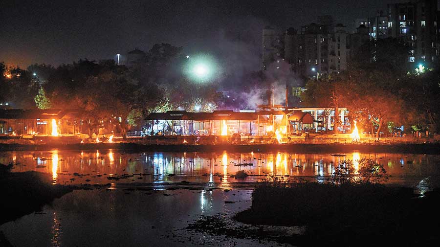 Rows of burning pyres at Baikunth Dham on  Thursday evening. 