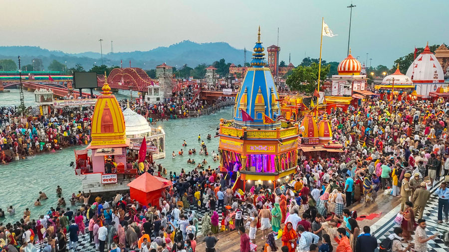 Devotees gather to offer prayers during the third Shahi Snan of the Kumbh Mela 2021, at Har ki Pauri Ghat in Haridwar on Wednesday.