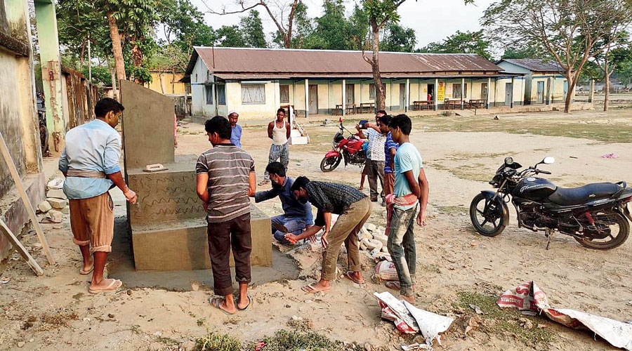 Villagers build a martyrs’ column at the spot  of the firing at Jorpatki.