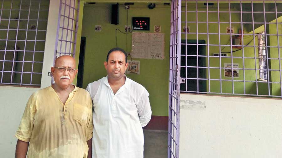 Dipak Kumar Basu and his son, Partha Sarathi, outside the mosque.