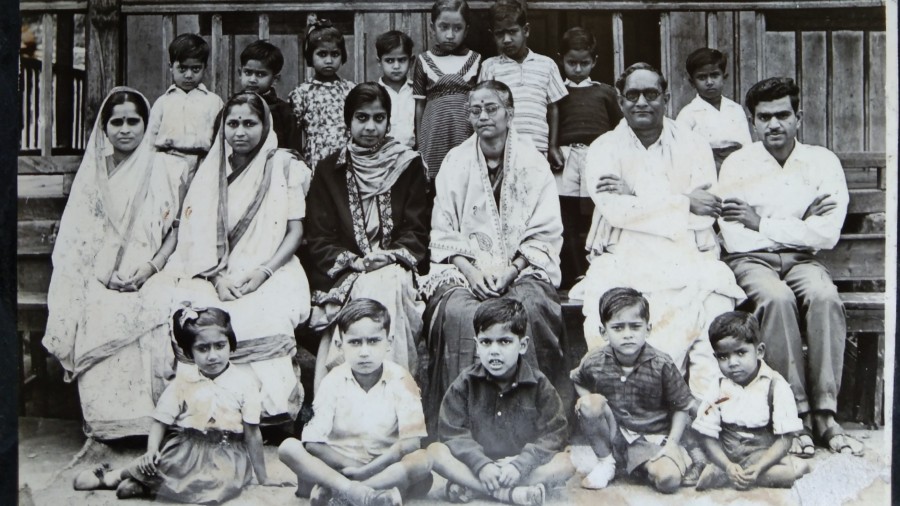 Rabindranath Bisharad (second from right) in front of Rilbong L.P. School, Shillong, along with other teachers and students