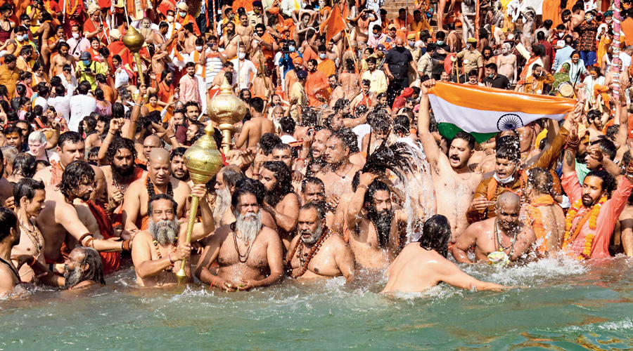 Devotees gather to offer prayers during the Shahi Snan at the Kumbh Mela in Haridwar on April 14.