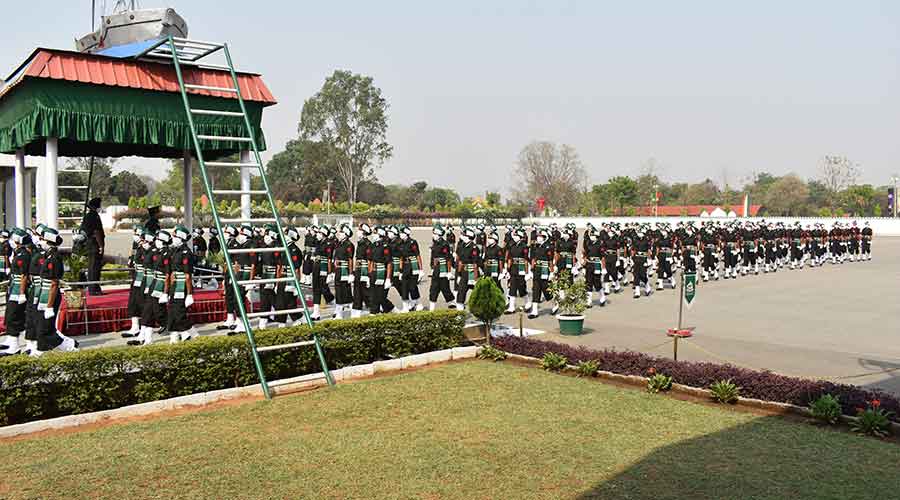 The Regimental band played 'Kadam – Kadam Badhaye Jaa' as the young soldiers prepared to take their oaths.