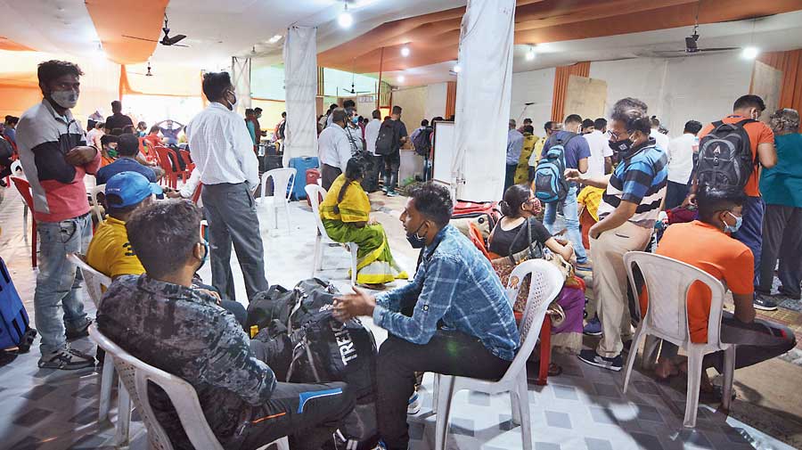 Passengers register their names for the Covid-19 test on their arrival at Guwahati railway station in Guwahati  on Saturday. 