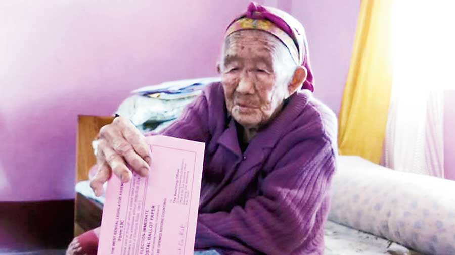 An elderly woman votes at her home in Kalimpong. The anonymous poll official did not visit this area 